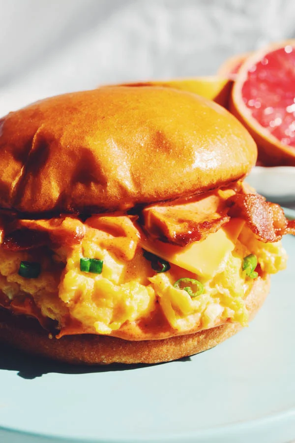 Eggslut signature dishes Fairfax Sandwich, Slut, Bacon Egg & Cheese Sandwich.